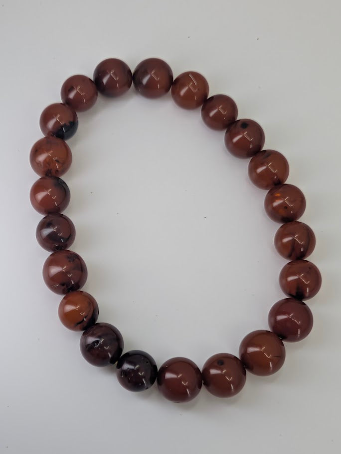Baltic Amber Bead Bracelet – full view of 8mm polished round beads with deep cognac color