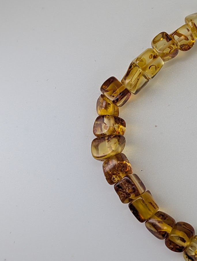 Close-up of Baltic Amber Bracelet 5.5 mm showing barrel-cut beads and transparency