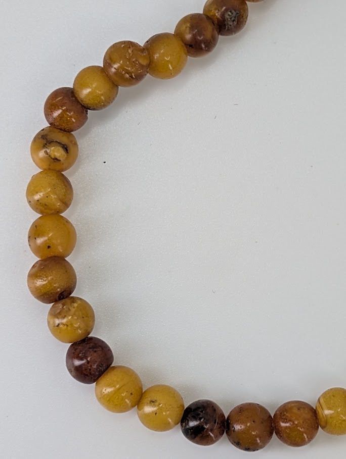 Close-up of Baltic Amber Bracelet 5–6 mm showing organic surface texture and natural inclusions