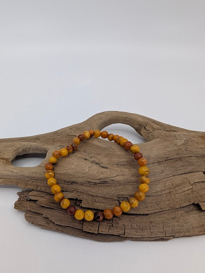 Baltic Amber Bracelet 5–6 mm Russian Origin – front view showing warm butterscotch and caramel tones