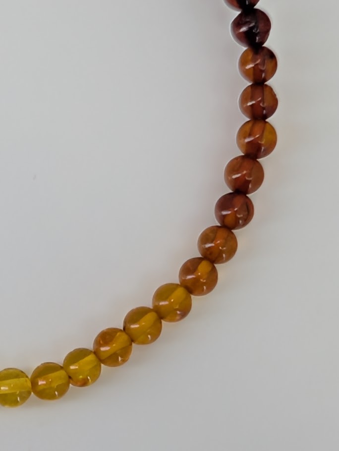 Baltic Amber Bracelets 4 mm and 4.8 mm – detailed close-up highlighting clarity and polish