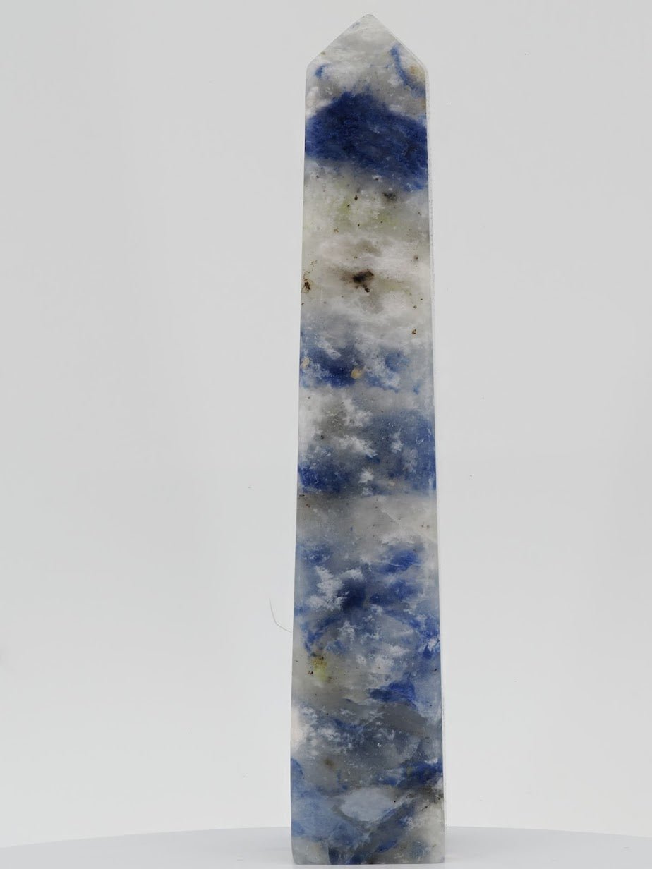 Polished Afghanite tower from Badakhshan featuring deep cobalt blue and white crystalline patterns.