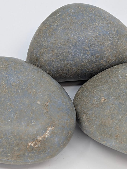 Angelite palm stones close-up showing smooth surface and gentle blue coloration