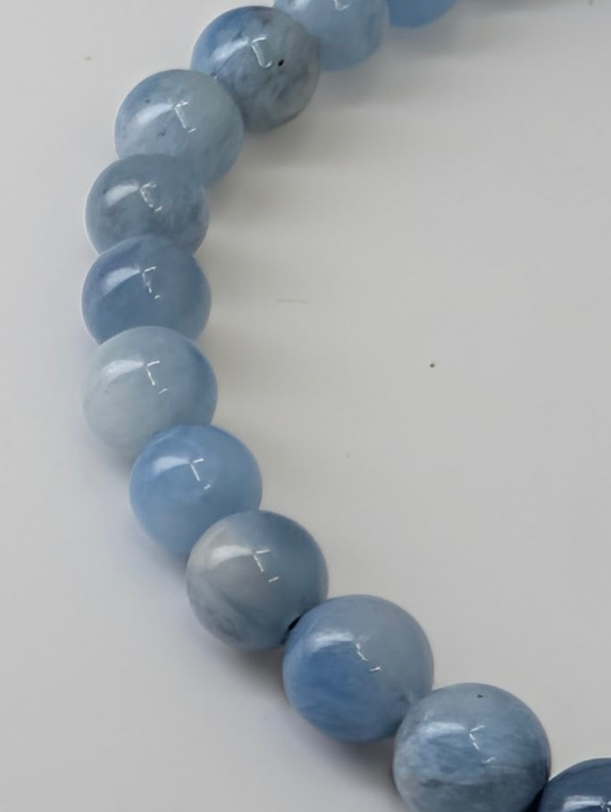 Detailed view of aquamarine bead texture and natural inclusions