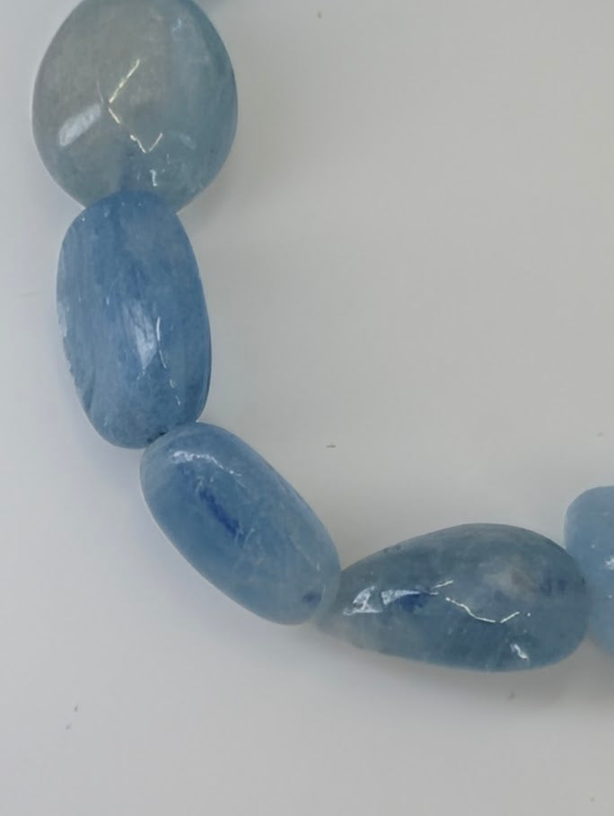 Detail view of Aquamarine bracelet showing soft texture and color gradient