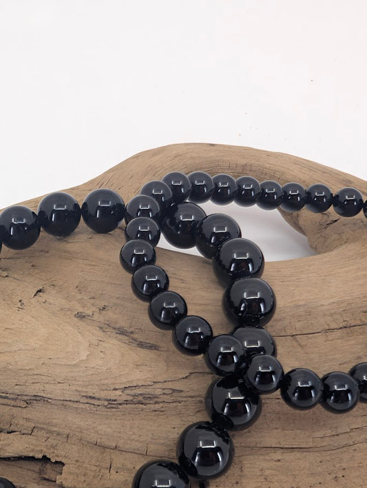 Close-up of Black Tourmaline bracelet showing smooth polished round beads
