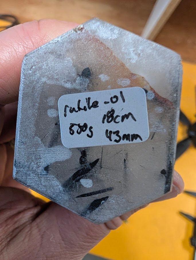 Base of quartz tower showing label and polish