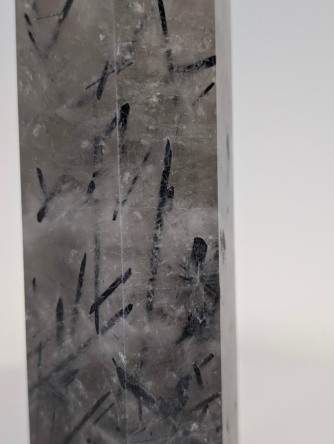 Tourmalinated quartz with clear body and black inclusions