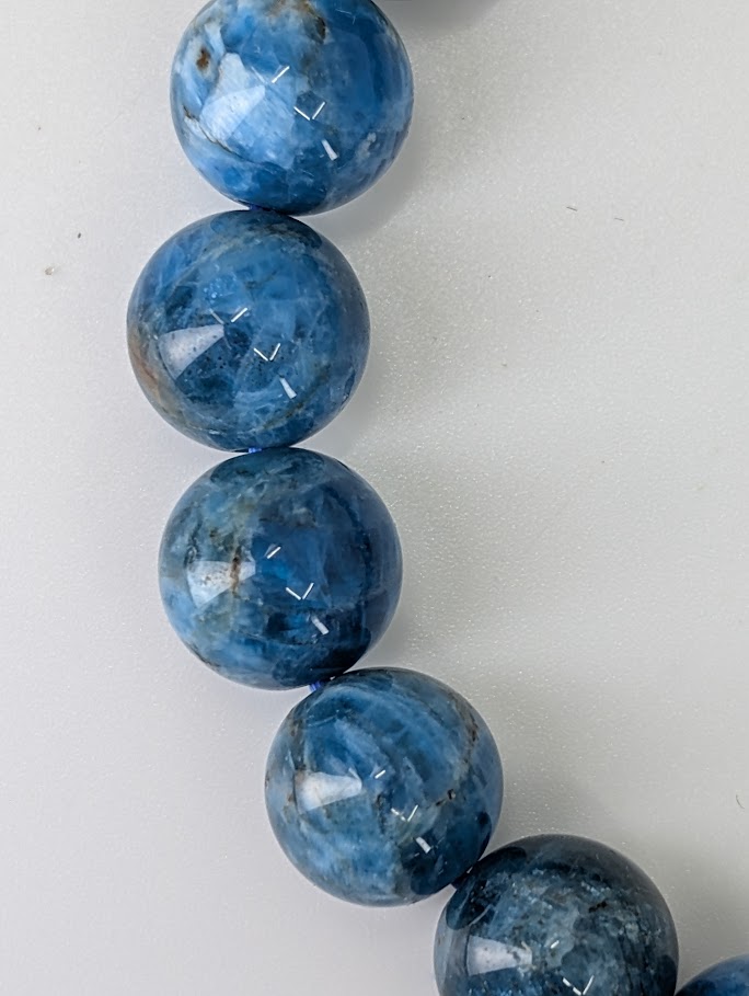 10 mm round Blue Apatite bracelet with vivid deep blue and natural matrix patterning