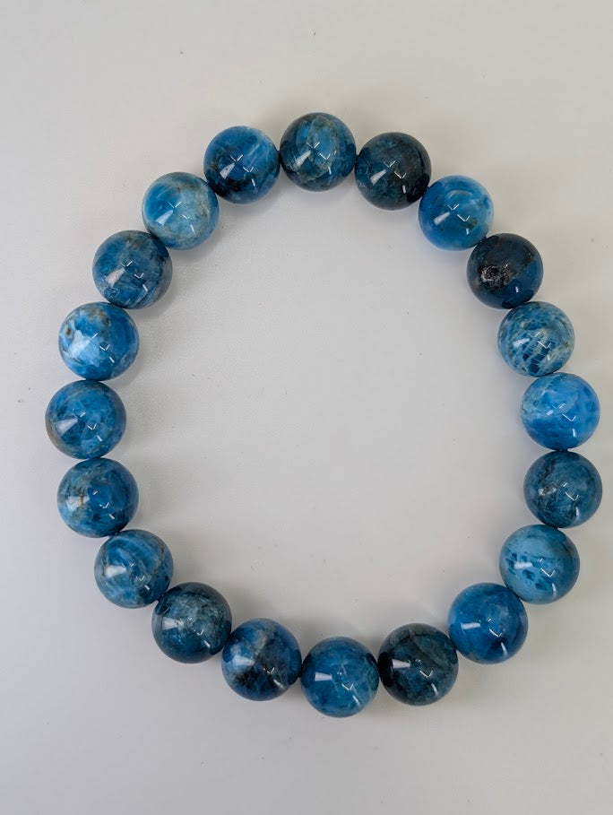 10 mm round Blue Apatite bracelet with vivid deep blue and natural matrix patterning