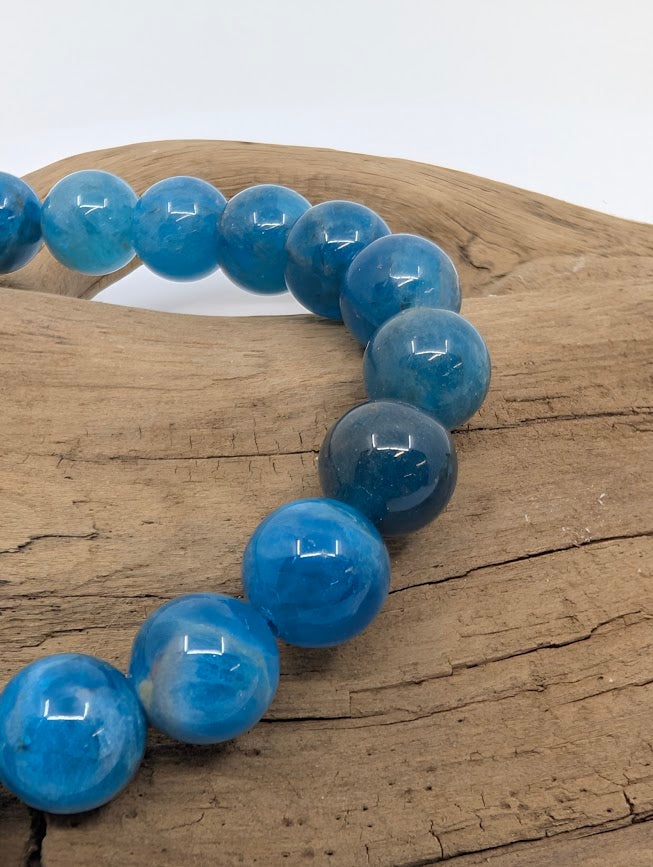 Macro of Blue Apatite beads with glossy finish and translucent “windows”