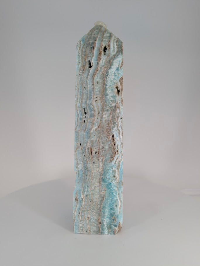 Blue Aragonite (Caribbean Calcite) Tower – side profile with layered banding and creamy calcite zones