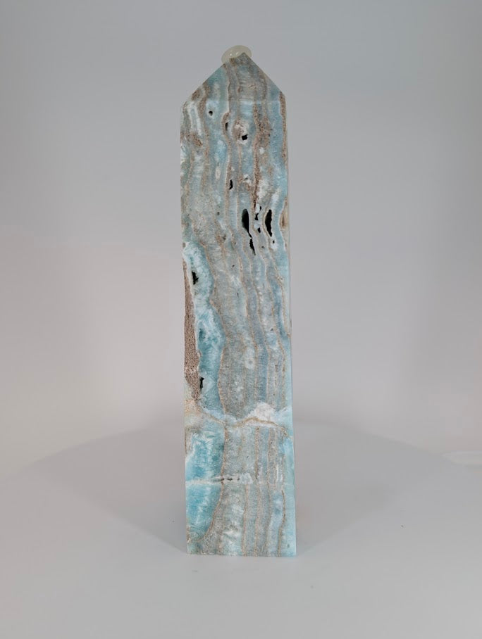 Blue Aragonite (Caribbean Calcite) Tower – alternate side showing natural cavities and polished finish