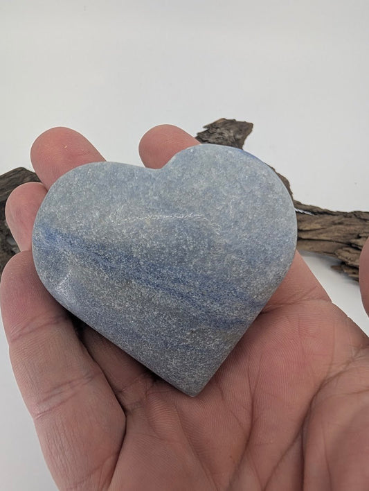 Hand holding a large 170g Blue Aventurine heart showing substantial size.