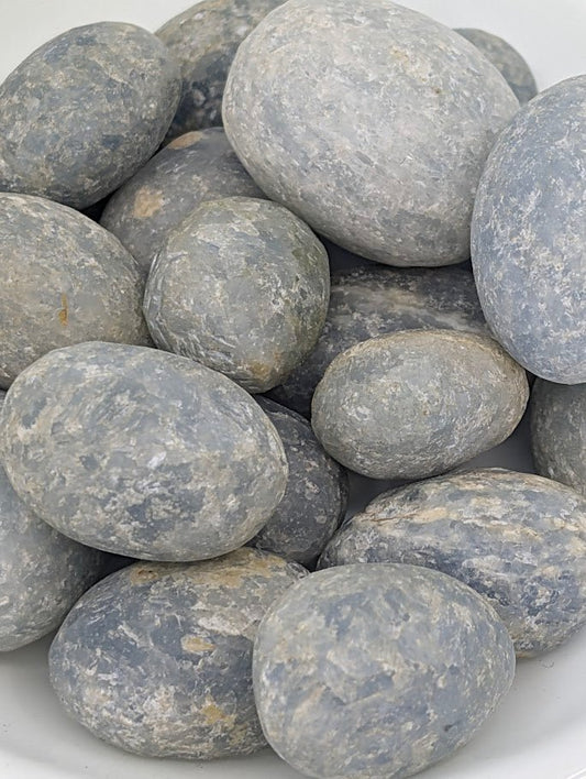 Close-up of Blue Calcite tumbled stones showing natural texture