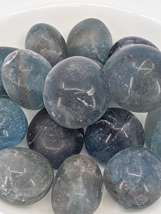 Close-up of Blue Fluorite tumbled stones showing tone and texture