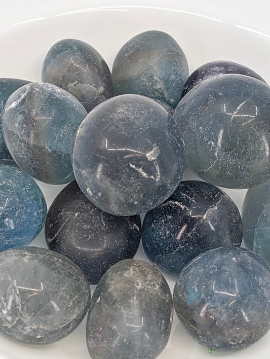 Close-up of Blue Fluorite tumbled stones showing tone and texture