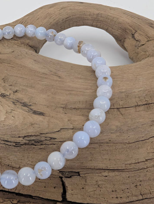 Close-up of Blue Lace Agate beads with natural lace pattern