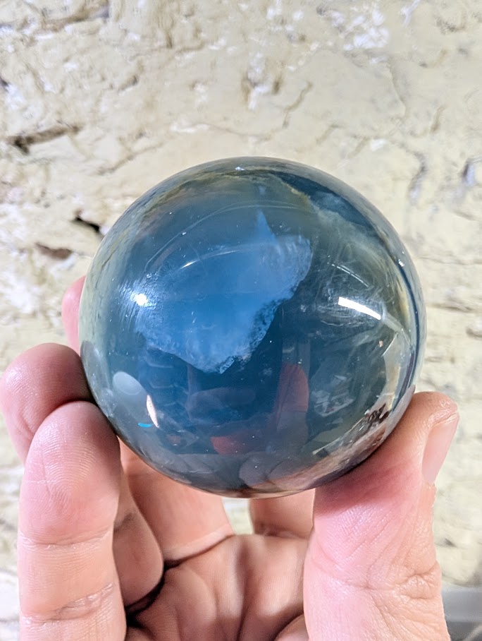 Translucent view of blue onyx sphere highlighting internal clarity