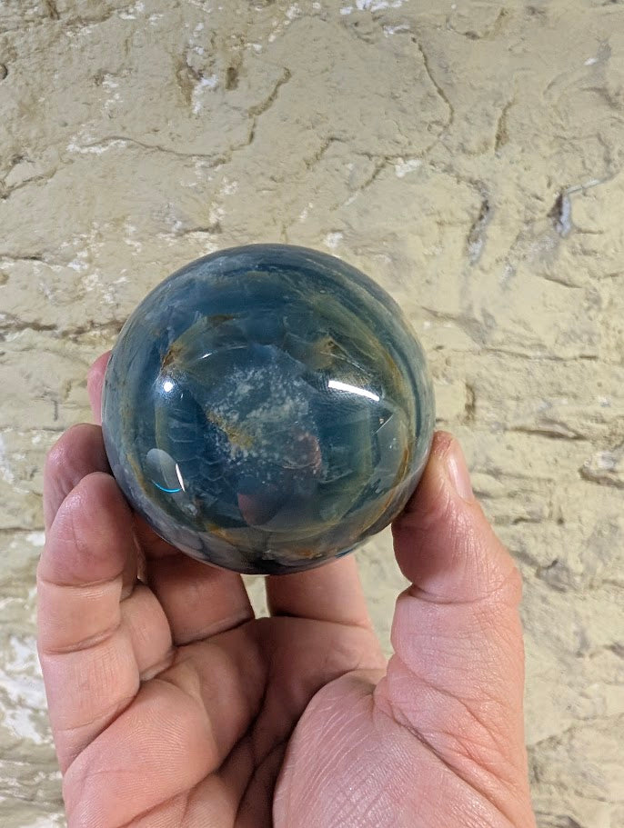 Base of sphere showing exposed natural calcite matrix