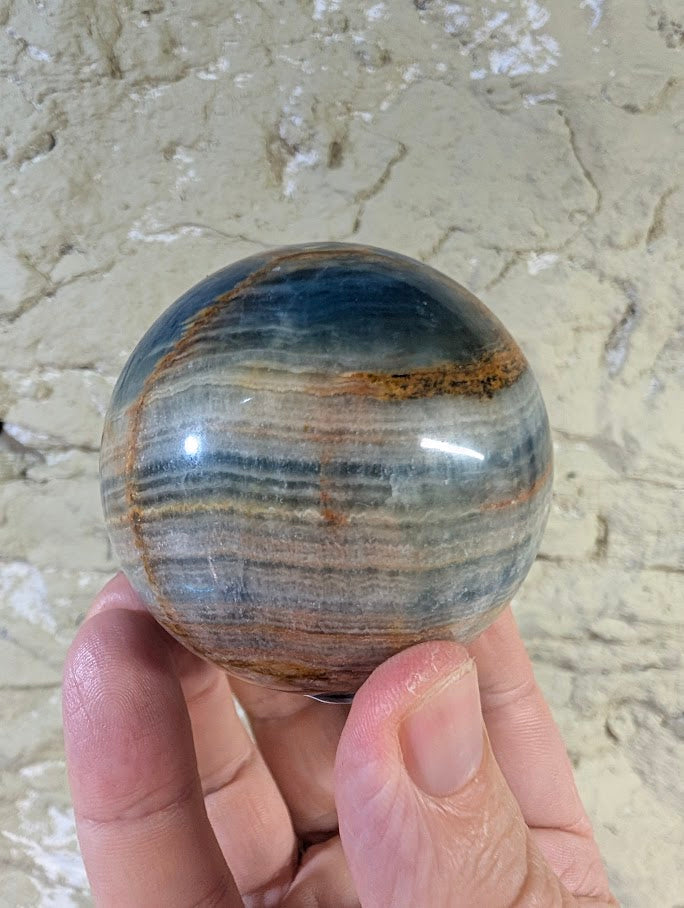 Close-up of golden seam on 60mm Blue Onyx Sphere