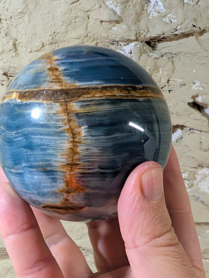 84mm blue calcite sphere with deep blue and white bands