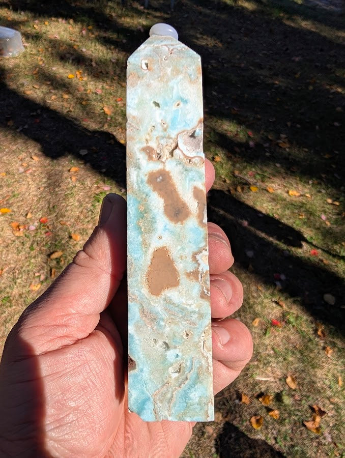 Caribbean Calcite Tower #4 angled view — polished aqua-blue calcite with beige inclusions