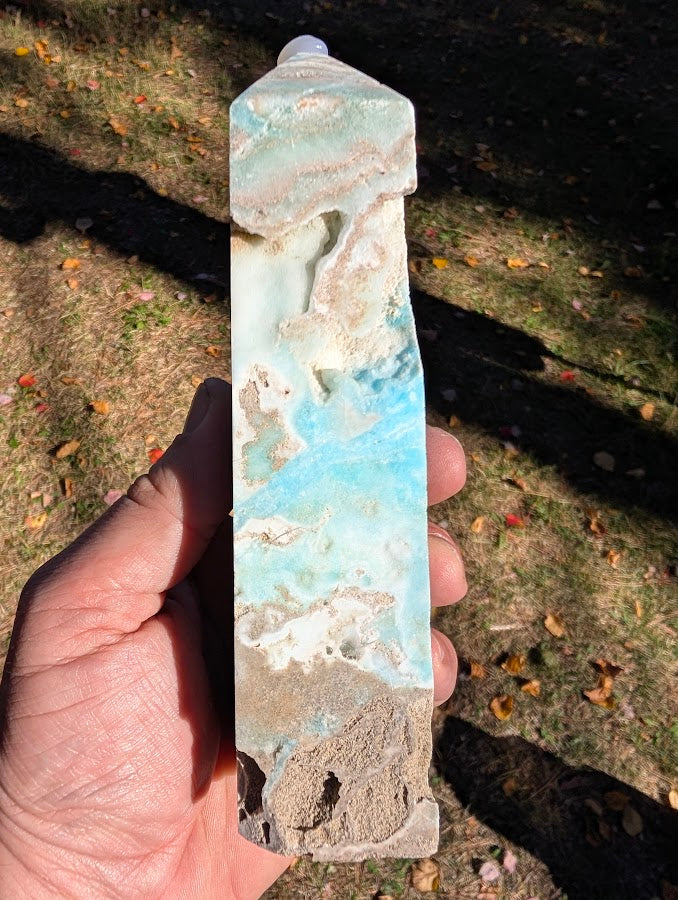 Caribbean Calcite Tower #5 angled view — bold aqua-blue calcite with natural cavities