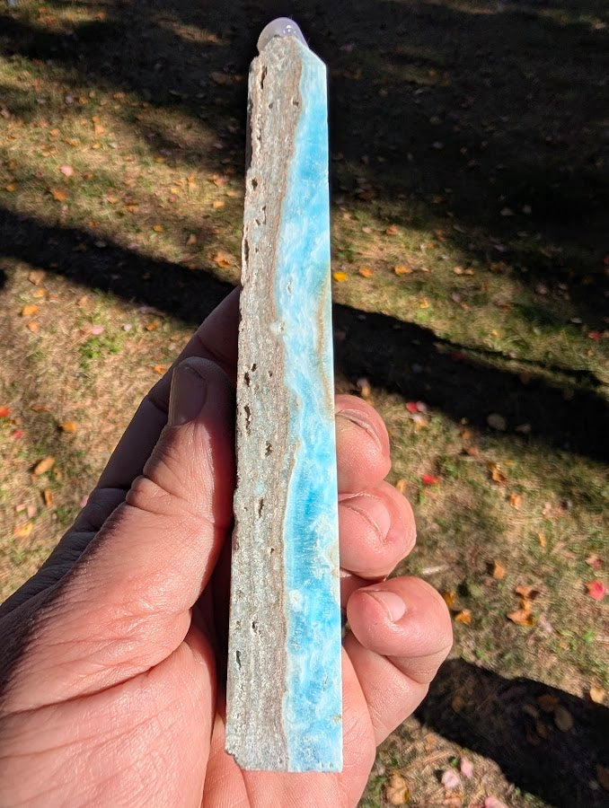 Caribbean Calcite Tower #6 angled view — slim aqua-blue calcite with natural cavities