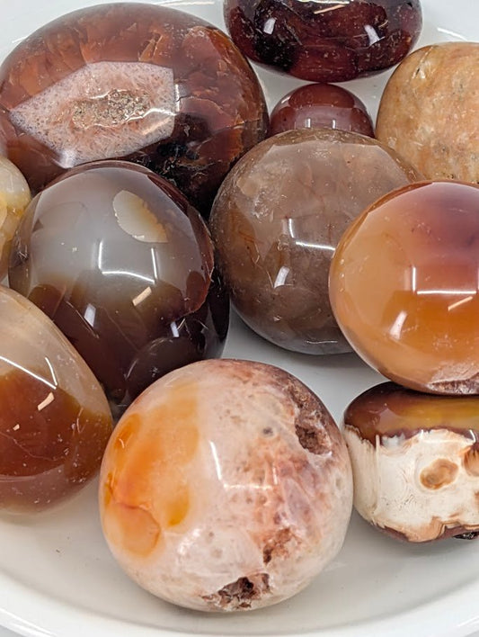 Close-up of Carnelian stones showing natural color banding and translucence