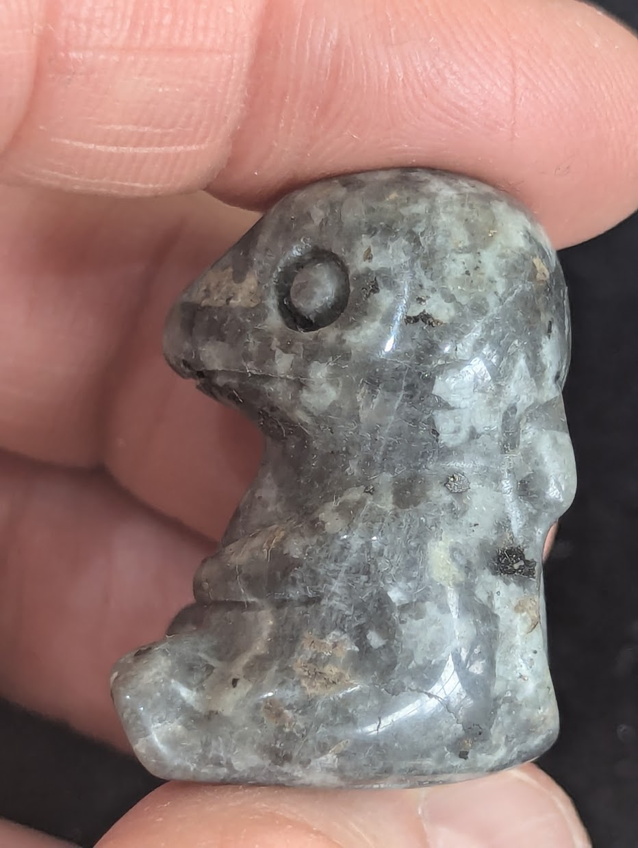 Macro profile shot showing the crystalline structure of a Labradorite Charmander totem.