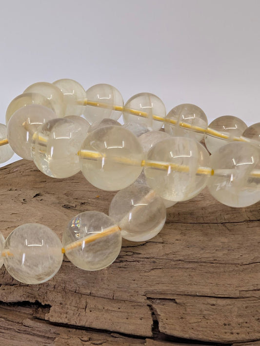 Close-up of 12mm and 13.5mm Brazilian citrine bracelet showing clarity and champagne-yellow quartz beads