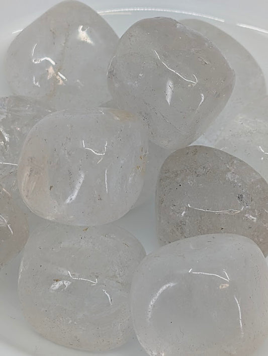 Close-up of Clear Quartz tumbled stones showing internal inclusions