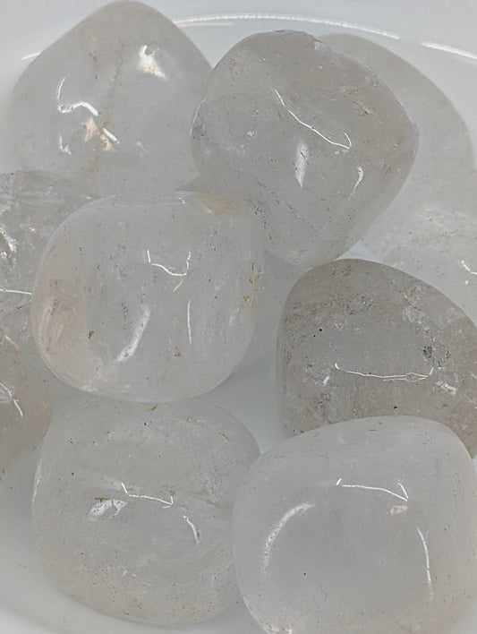 Close-up of Clear Quartz tumbled stones showing internal inclusions