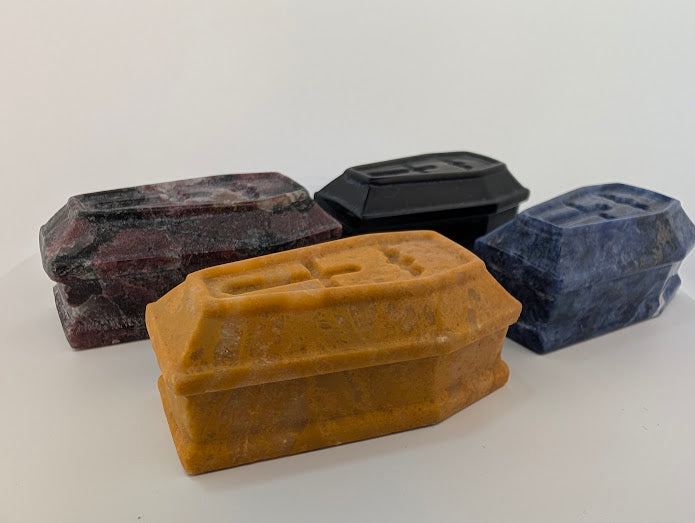 Side view showing depth and carving detail of crystal coffins