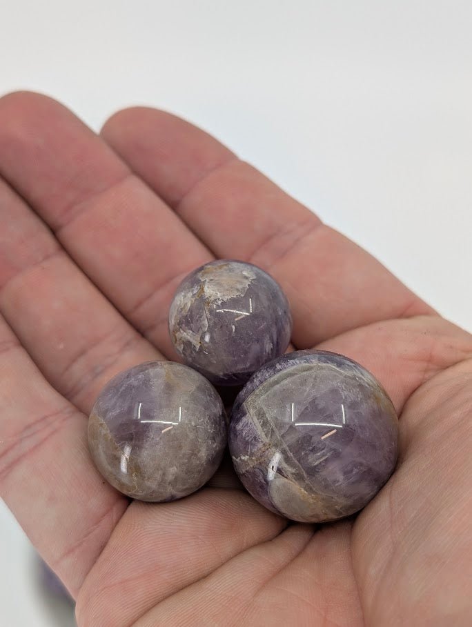 Dream Amethyst mini sphere large with polished quartz and purple banding