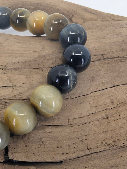 Closeup of Dream Tiger’s Eye beads showing mixed blue and gold chatoyancy