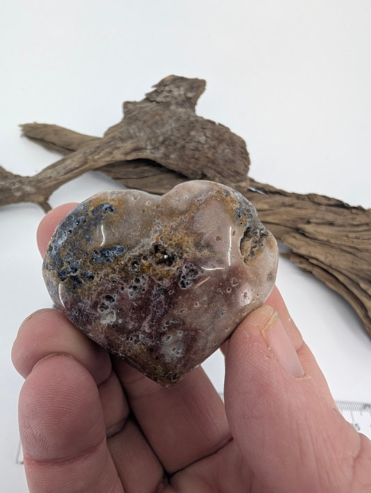 Hand holding a 60g Druzy Sphalerite heart showing texture and sparkle.