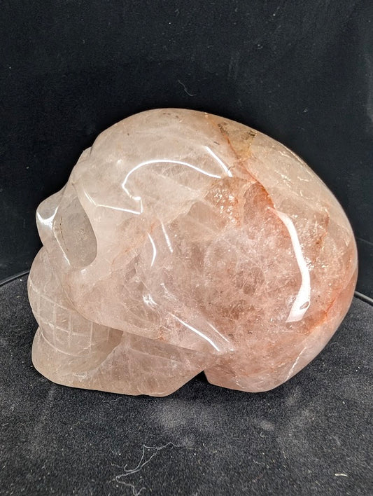 Right profile of Fire Quartz skull highlighting hematite wisps