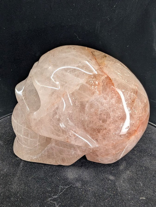 Right profile of Fire Quartz skull highlighting hematite wisps