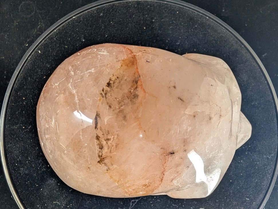 Top view of Fire Quartz skull displaying broad hematite band inside clear quartz