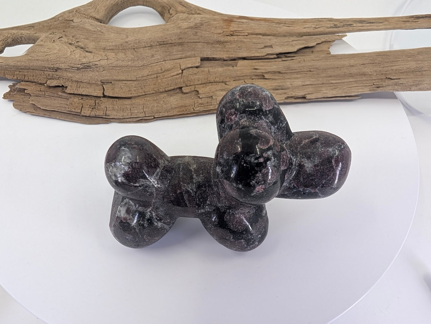 Top-down view of Garnet in Matrix balloon dog A showcasing mineral density and texture.