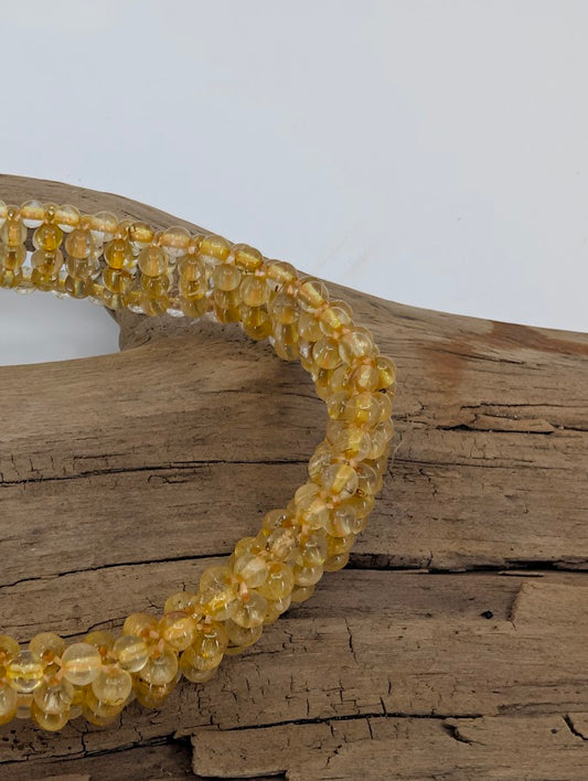 Side view showing multiple polished strands and golden reflections