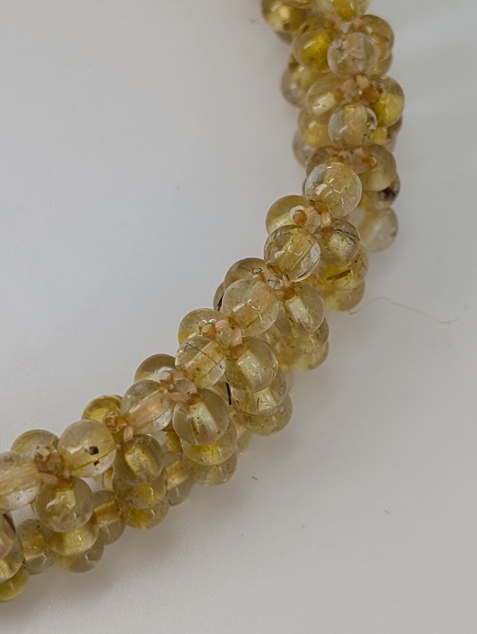 Macro image showing woven bead texture and clarity