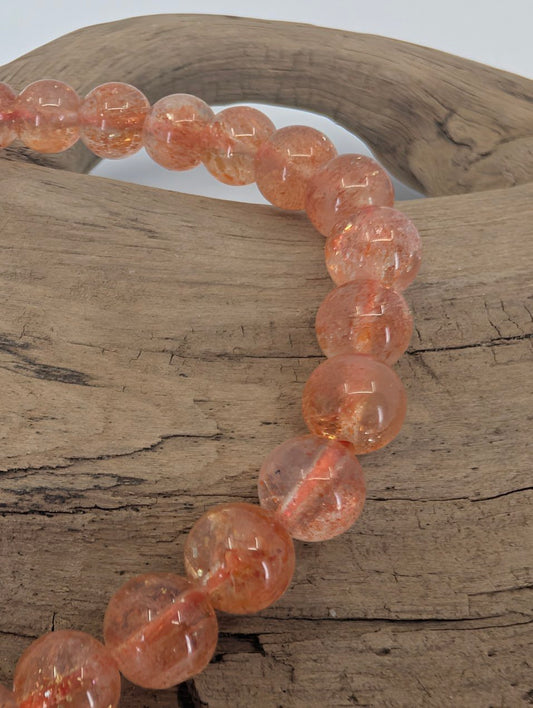 Closeup of Golden Sunstone beads showing coppery shimmer