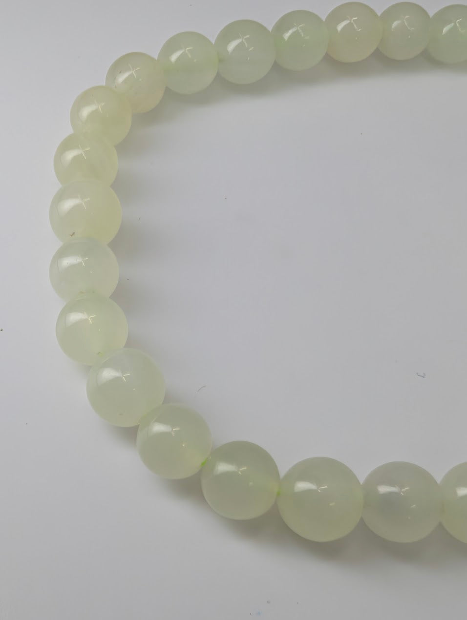Detailed view of polished Green Calcite beads