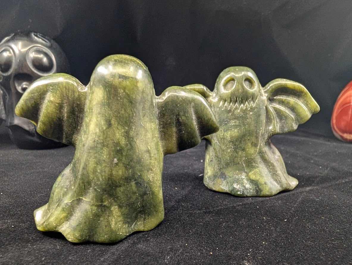 Side/angled view of Green Jade Ghost carving – polished hand-carved jade