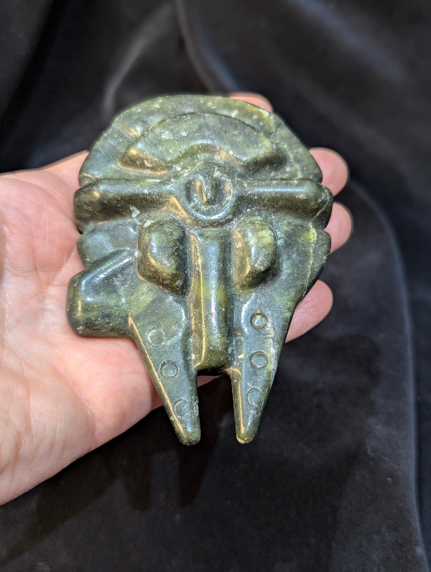 op-down view of green Nephrite Jade Millennium Falcon showcasing natural mineral veining