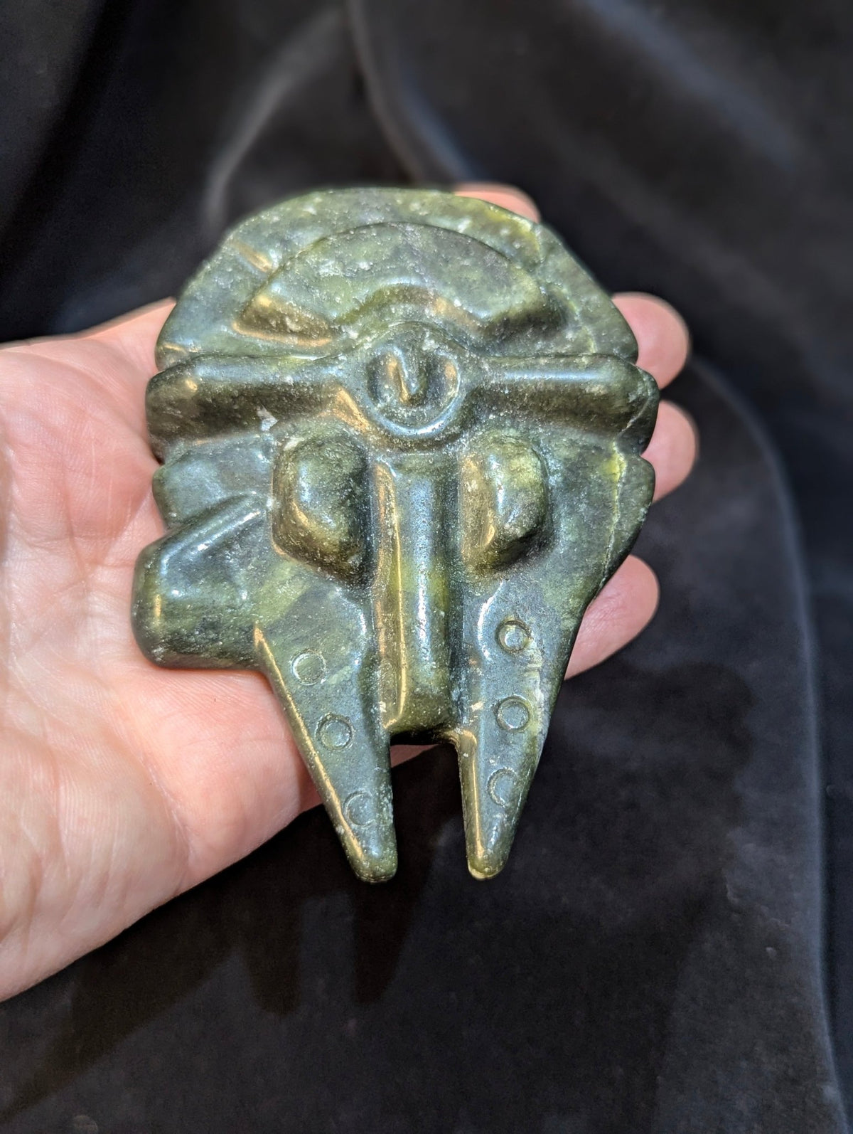 op-down view of green Nephrite Jade Millennium Falcon showcasing natural mineral veining
