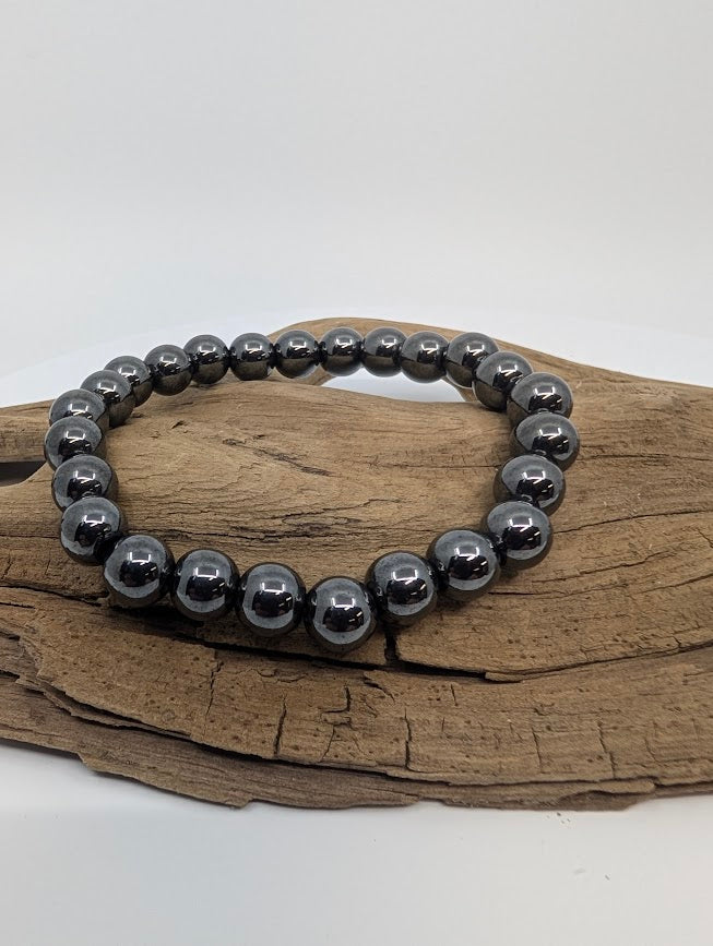 8mm round bead stretch bracelet on driftwood with mirror metallic shine